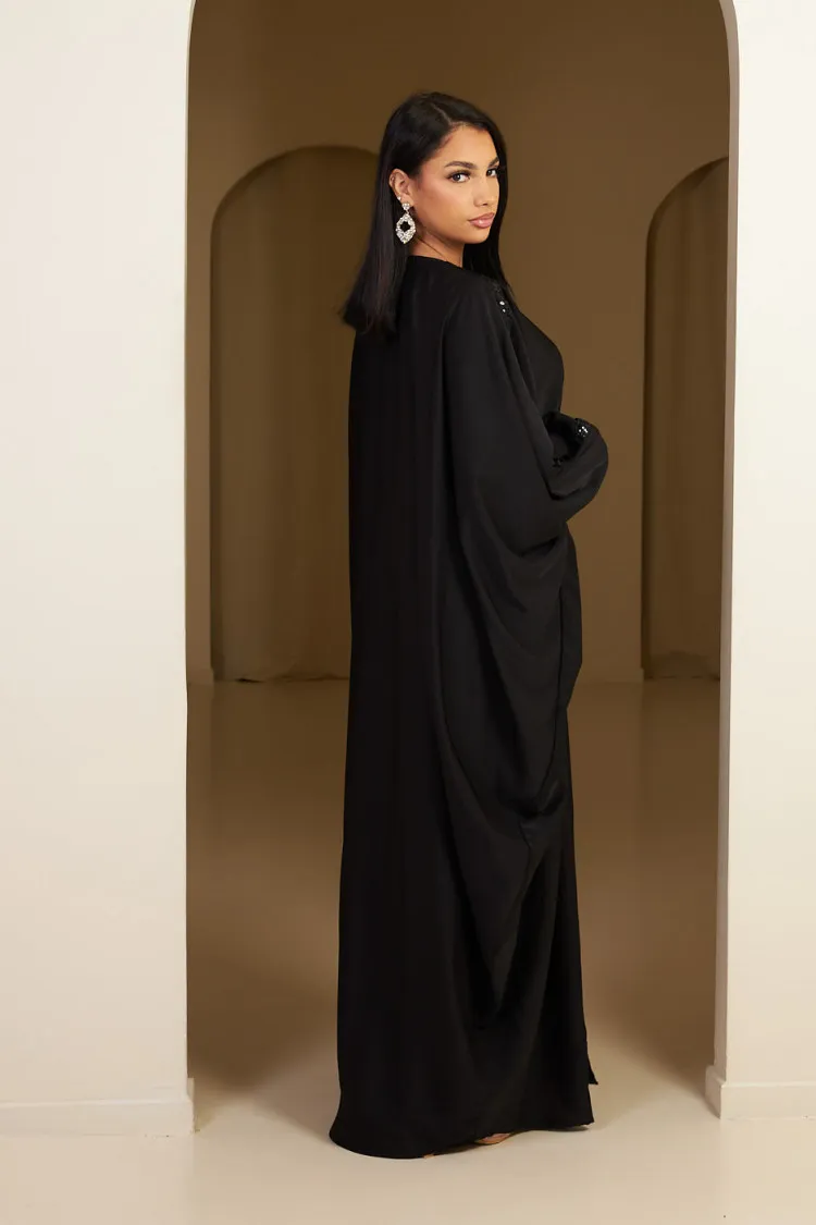 Abaya noire à empiècement sequins et pompom noir