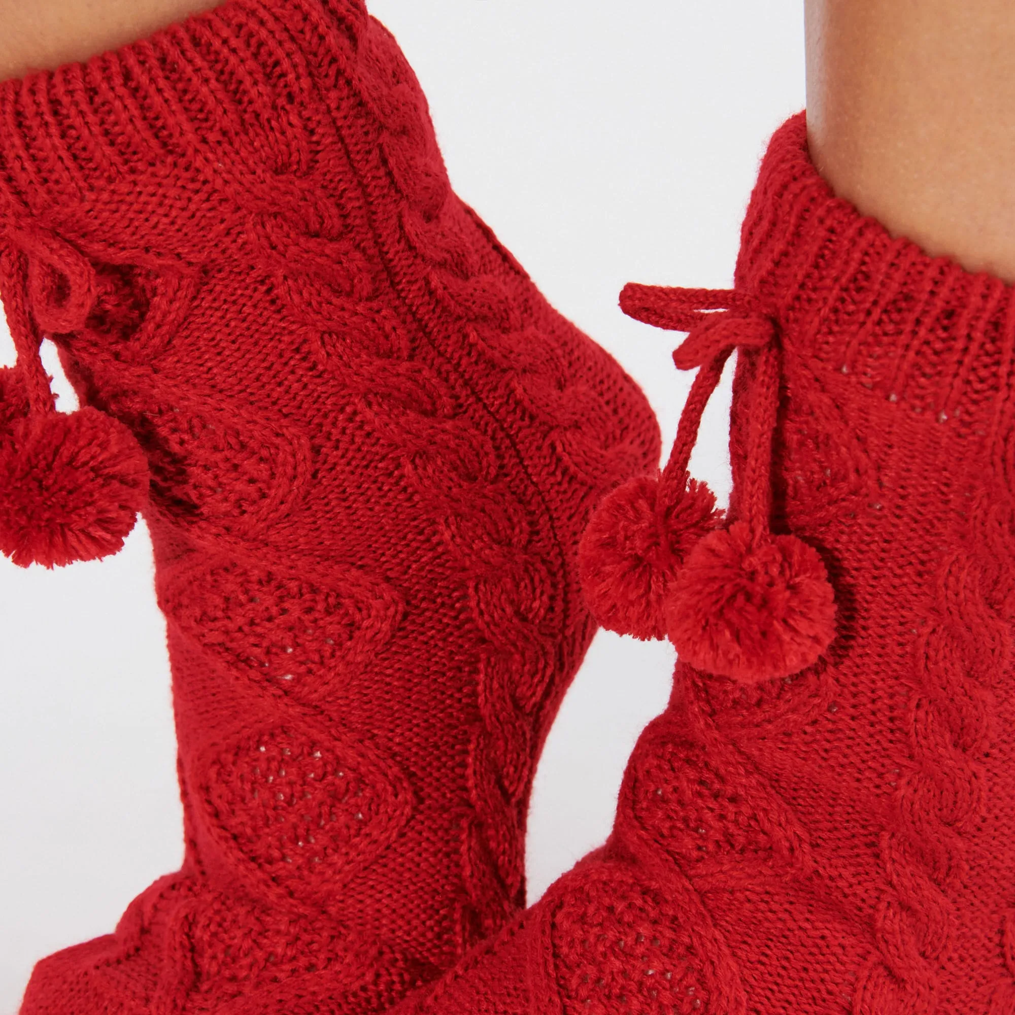 Chaussettes montantes avec pompon