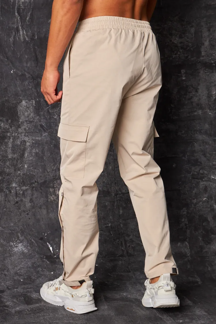 Pantalon de jogging cargo à boutons pressions beige