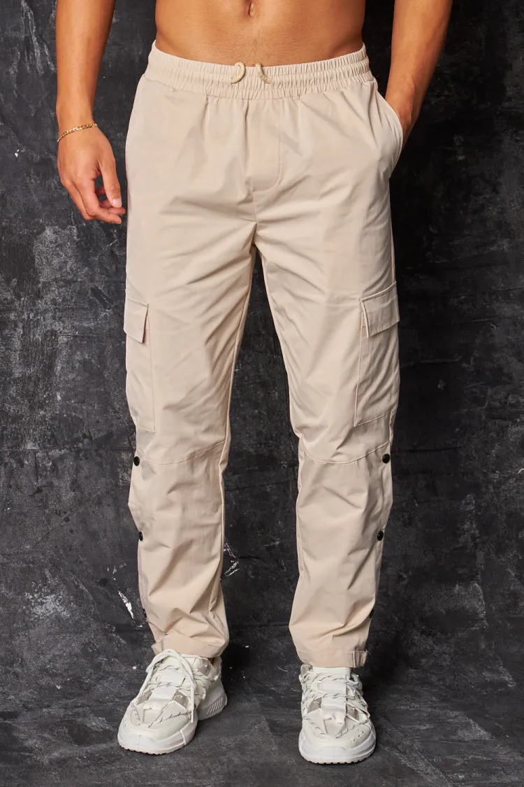 Pantalon de jogging cargo à boutons pressions beige